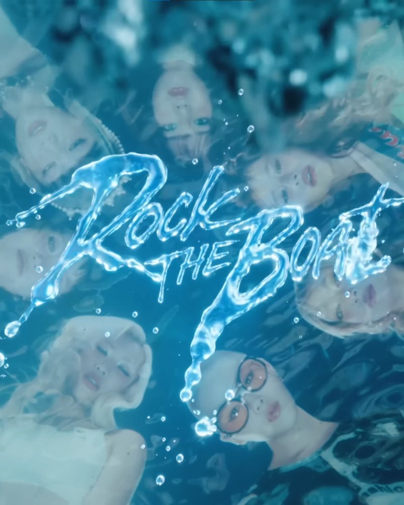 XG members underwater with the Rock The Boat liquid logo